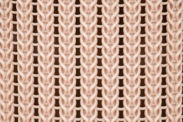 The texture of a plastic wicker basket closeup.