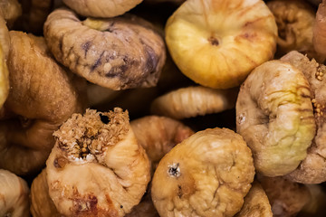 Selling dried figs in a supermarket. Fruits for a healthy diet.