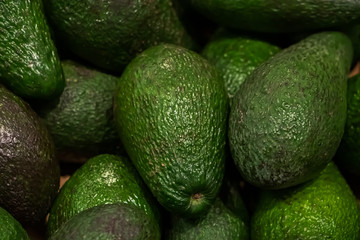 Selling ripe  avocado in a store. Vegan food.