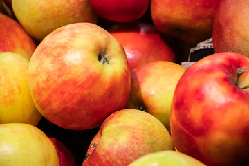 Fototapeta na wymiar Juicy apples at a farmers market. Ripe fruits close up.