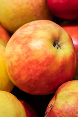 Juicy apples at a farmers market. Ripe fruits close up.