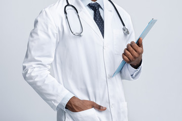 Cropped of black therapist holding medical chart