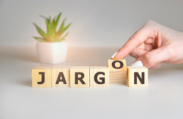 Jargon - hand holding word from wooden blocks with letters, special words and phrases jargon...