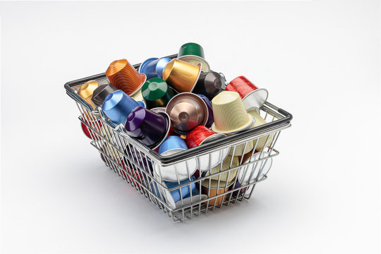 aluminum basket with several espresso coffee capsules isolated on white background