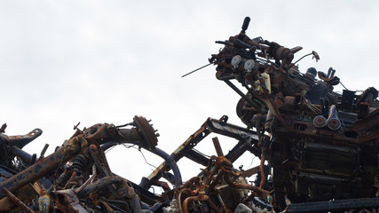 automobile dump of rusty metal. structures and scrap texture. broken parts, rusty wheel springs,...
