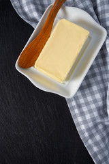 butter on black stone surface