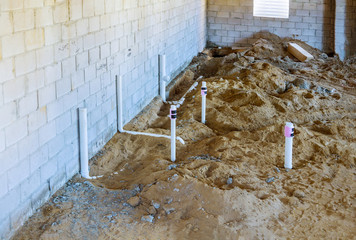 PVC drain pipes in a new house in basement in the ground