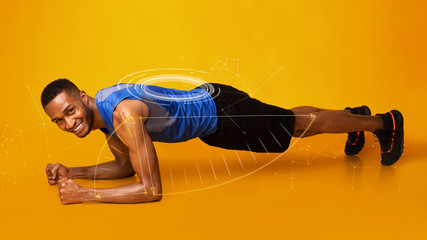 Fit African American man doing plank exercise on orange background, collage. Panorama