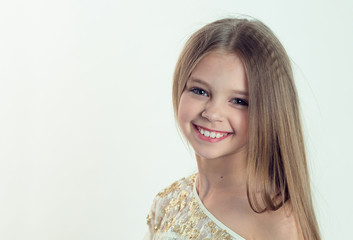 Smile, gorgeous. Portrait closeup of funny, excited joyful girl female child laughing kid smiling girl long hair looking at you isolated white background wall. Positive human emotion facial expression