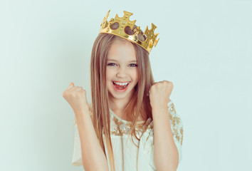 Happy girl with crown pumping fists celebrates success victory © hbrh