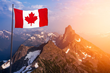 Canadian National Flag Composite over the Aerial View of Beautiful Rocky Mountain Landscape during sunny Sunset. Taken in Remote Area near Vancouver, British Columbia, Canada.