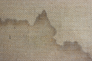 Loose fabric on the underside of the carpet.