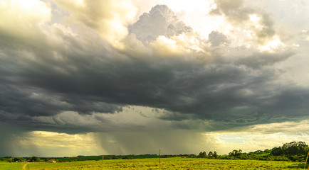 Farm area in southern Brazil and Cumulunimbus Clouds causing rain in summer afternoon