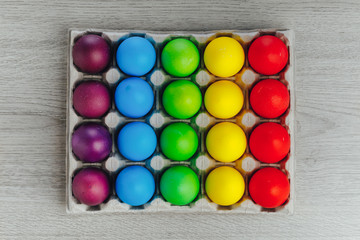 Fototapeta na wymiar Easter festive multicolor eggs carton