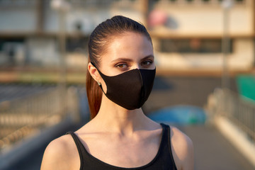 Woman wears a black mask to protect herself from the covid-19 coronavirus in Bangkok, Thailand.