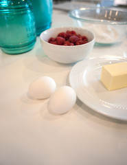 eggs and butter and raspberries and other baking ingredients