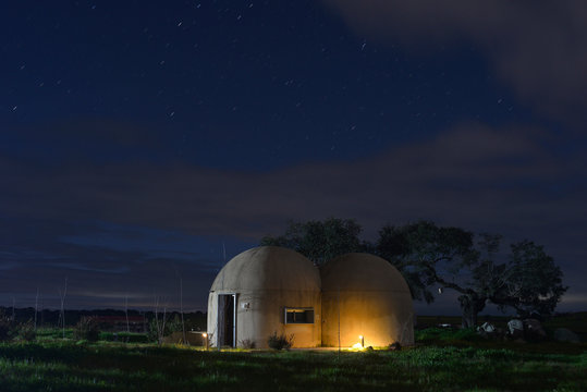 Night photography of round houses similar to the star wars of Ceclavin in Extremadura