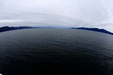 Alaska / USA - August 15, 2019: Alaska coastline view from a cruise ship deck, Alaska, USA