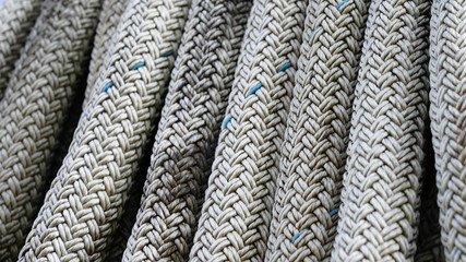 wicker rope texture. ship mooring rope composition. white synthetic rope macro photo