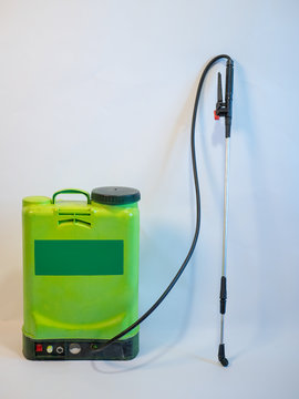 New green agricultural electric sprayer on white background. It can be used for disinfection of rooms, living rooms, vehicles. Coronavirus Control
