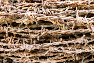 old rusty barbed wire background.