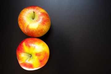 Apples on black table, food background