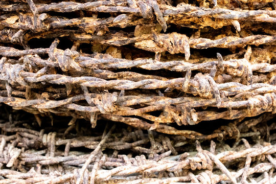 old rusty barbed wire background.