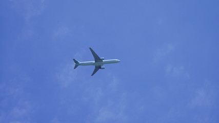 passenger plane on a background of blue sky. flying airliner comes in for a landing. plane in the deep sky with clouds
