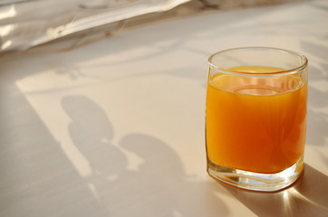 one glass glass with a buckthorn window swell on the windowsill