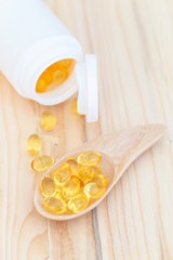 Obraz na płótnie Canvas Fish oil capsules with omega 3 and vitamin D