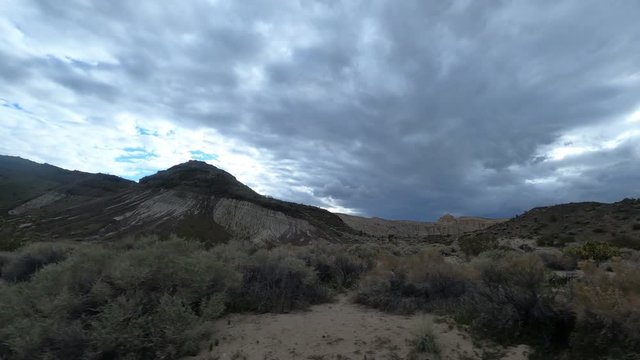 Clip of desert with clouds in Red Rock Canyon National Conservation Area. Redrock video shot by a a car moving