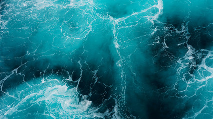 Abstraction of sea foam in the ocean. Dark water, storm waves