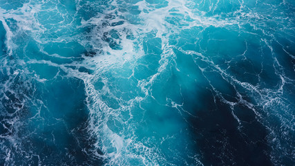 Abstraction of sea foam in the ocean. Dark water, storm waves