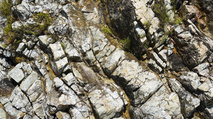 Obraz premium Stone texture, abstract background, uneven lines, bends of stone layers. Natural pattern for your product.wavy structure of layers of stone