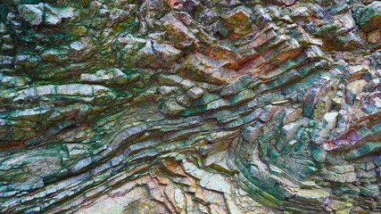 Stone texture, abstract background, green stone. Natural pattern for your product. Curved soft lines in rock, 
frozen volcanic lava