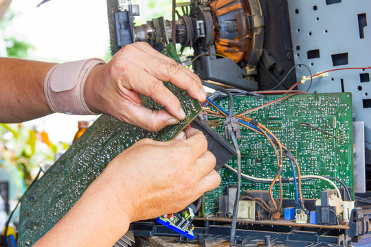 Technician Repairing Old Television Or Tv Vintage In Repair Shop