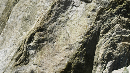 Stone texture, abstract background, uneven lines, bends of stone layers. Natural pattern composition.