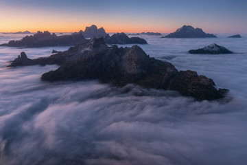 View of famous Dolomites mountain peaks glowing in beautiful golden morning light at sunrise in summer, South Tyrol,Italy
dramatic view of dolomites mountains above the clouds
Famous best alpine place
