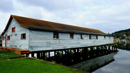 old wooden house on the water