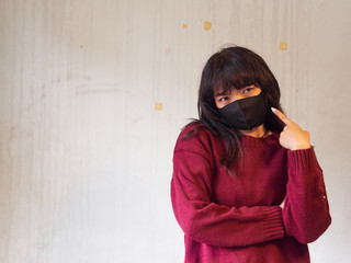 Obraz premium Close-up of Young woman wearing face mask. Girl with protective mask on face against Coronavirus Disease 2019.