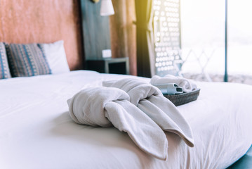 Fototapeta na wymiar White couple towel in bedroom,Stack of plush hotel towels