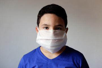 boy wearing protective medical mask