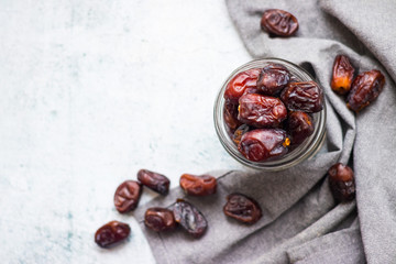 Date fruites, dates or sweet Iranian hurma in glass jar. Natural organic dieting dessert food. Vegan meal. Copy space. Top above view - obrazy, fototapety, plakaty