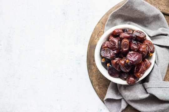 Date fruites, dates or sweet Iranian hurma. Natural organic dieting dessert food. Vegan meal. Copy space