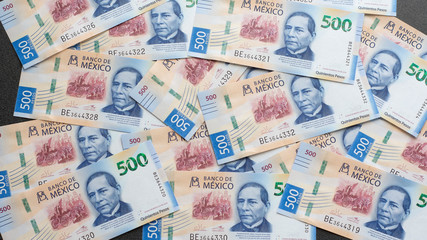 Fototapeta na wymiar Mexican 500 pesos pile of blue bucks scattered front side