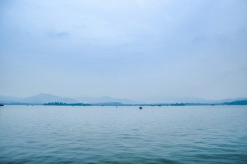 grand lake with white sky background and trees