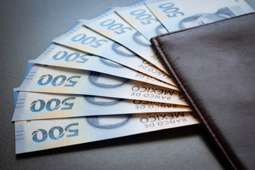 Mexican 500 pesos pile of blue bucks inside a wallet