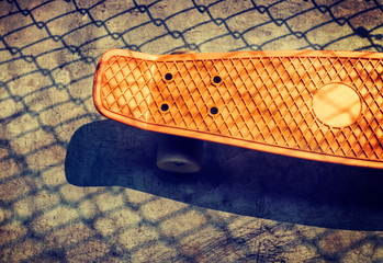 Aerial view of orange skateboard on the ground © Rawpixel.com