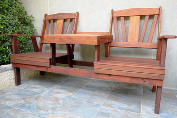 wood chair furniture in front of the house