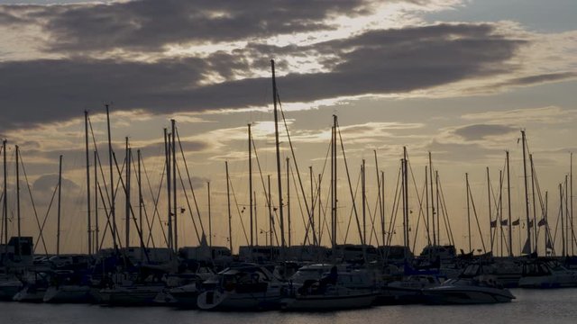 Yacht and sailboats in the harbor
